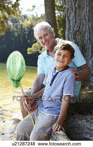Man and boy fishing together View Large Photo Image Stock Photo - Man and boy fishing together. Fotosearch