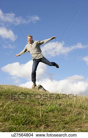 Picture - Man in countryside. Fotosearch