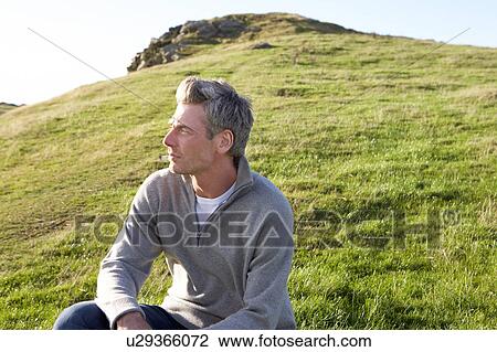 Stock Image - Man in countryside. Fotosearch