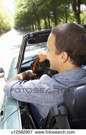 Man in sports car View Large Photo Image Stock Photo - Man in sports car. Fotosearch