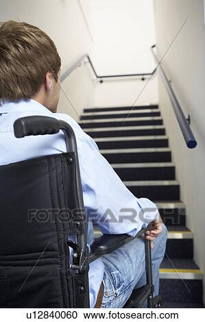 Man in wheelchair at foot of stairs View Large Photo Image Stock Image - Man in wheelchair at foot of stairs. Fotosearch