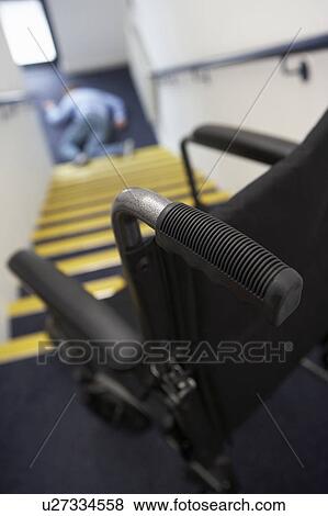 Man in wheelchair falling downstairs View Large Photo Image Stock Photo - Man in wheelchair falling downstairs. Fotosearch