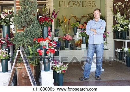 Man standing outside florist View Large Photo Image Stock Photography - Man standing outside florist. Fotosearch