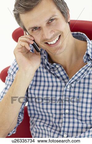 Picture - Man talking on the phone. Fotosearch