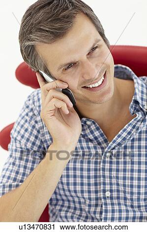 Man talking on the phone View Large Photo Image Stock Image - Man talking on the phone. Fotosearch