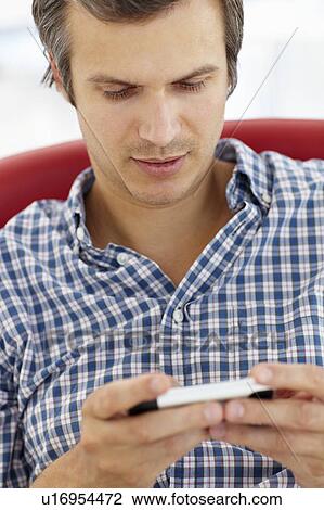 Man texting View Large Photo Image Stock Image - Man texting. Fotosearch
