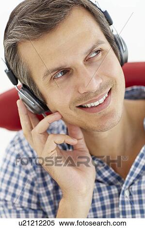 Man with headphones View Large Photo Image Stock Photography - Man with headphones. Fotosearch