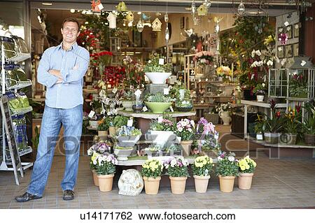 Stock Image - Man working in florist. Fotosearch