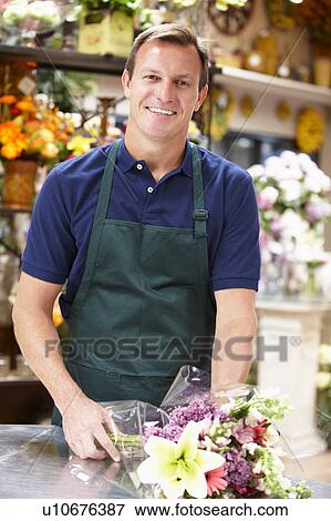 Man working in florist View Large Photo Image Stock Photo - Man working in florist. Fotosearch