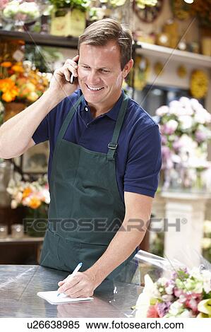 Man working in florist View Large Photo Image Stock Photography - Man working in florist. Fotosearch