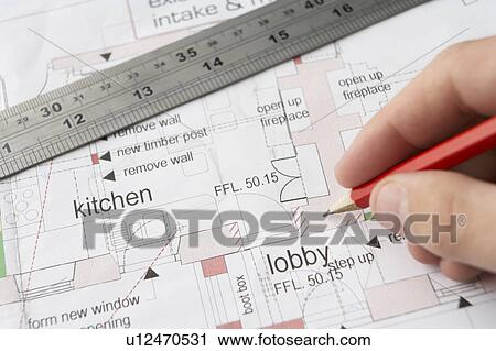 Man working on technical drawing View Large Photo Image Stock Image - Man working on technical drawing. Fotosearch