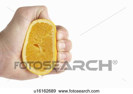 Stock Photo - Man's hand squeezing lemon. Fotosearch