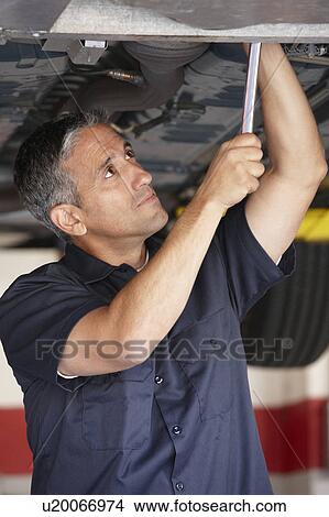 Mechanic at work View Large Photo Image Picture - Mechanic at work. Fotosearch