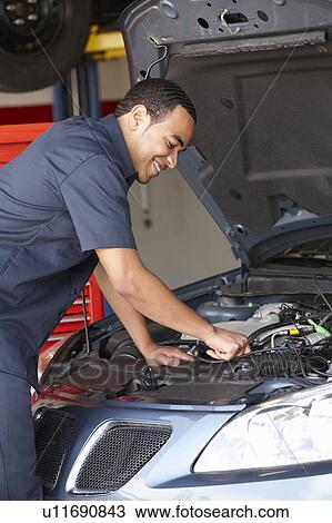 Mechanic at work View Large Photo Image Stock Image - Mechanic at work. Fotosearch