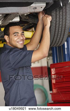 Mechanic at work View Large Photo Image Stock Image - Mechanic at work. Fotosearch