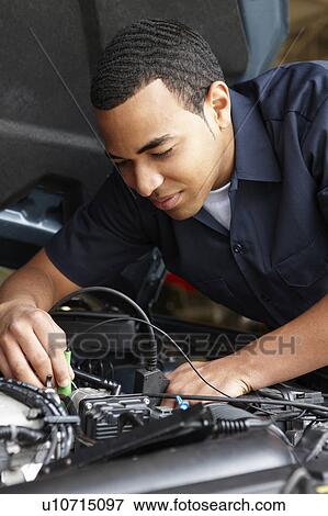 Stock Photo - Mechanic at work. Fotosearch