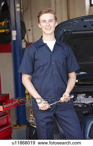 Mechanic at work View Large Photo Image Stock Photo - Mechanic at work. Fotosearch