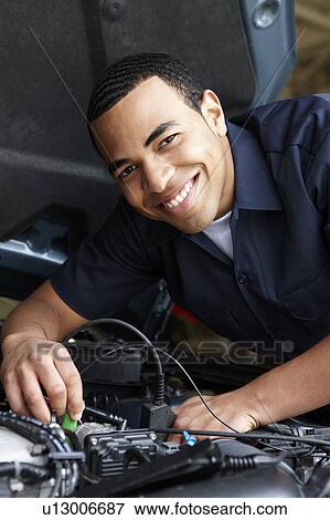 Mechanic at work View Large Photo Image Stock Photo - Mechanic at work. Fotosearch