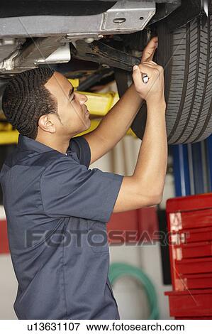 Mechanic at work View Large Photo Image Stock Photo - Mechanic at work. Fotosearch