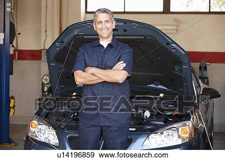 Mechanic at work View Large Photo Image Stock Photo - Mechanic at work. Fotosearch