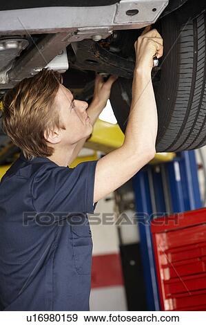 Stock Photo - Mechanic at work. Fotosearch