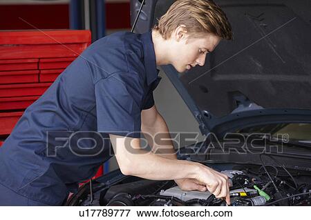 Stock Photo - Mechanic at work. Fotosearch