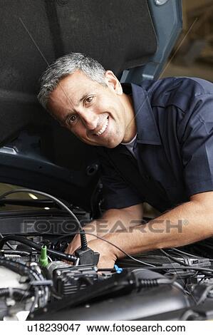 Stock Photo - Mechanic at work. Fotosearch