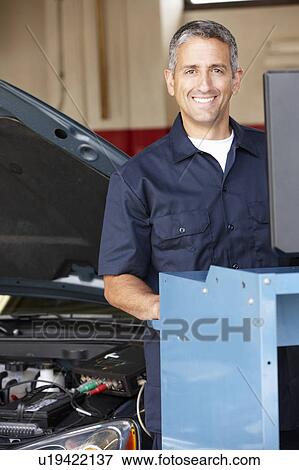 Stock Photo - Mechanic at work. Fotosearch