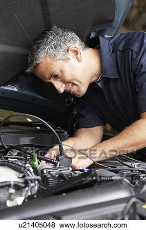 Stock Photo - Mechanic at work. Fotosearch