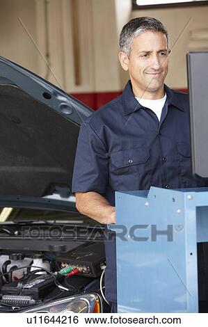 Stock Photograph - Mechanic at work. Fotosearch