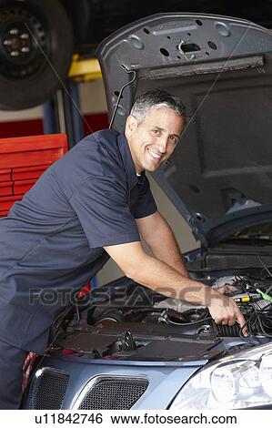 Stock Photograph - Mechanic at work. Fotosearch