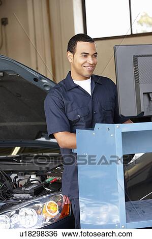 Stock Photograph - Mechanic at work. Fotosearch