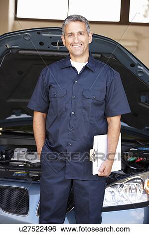 Mechanic at work View Large Photo Image Stock Photograph - Mechanic at work. Fotosearch
