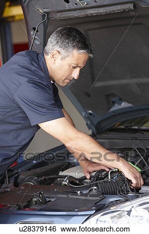 Mechanic at work View Large Photo Image Stock Photograph - Mechanic at work. Fotosearch