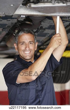 Mechanic at work View Large Photo Image Stock Photography - Mechanic at work. Fotosearch