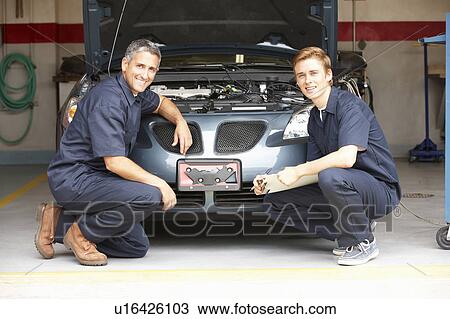 Stock Image - Mechanics at work. Fotosearch