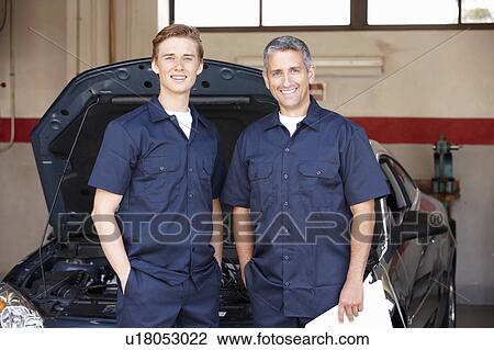 Stock Image - Mechanics at work. Fotosearch