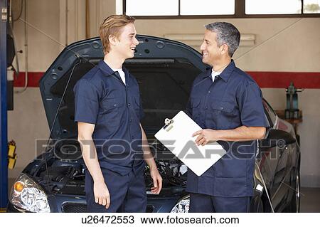 Stock Image - Mechanics at work. Fotosearch