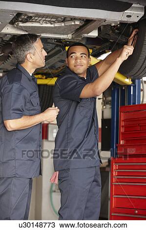 Mechanics at work View Large Photo Image Stock Image - Mechanics at work. Fotosearch