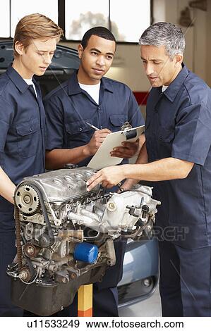 Stock Photo - Mechanics at work. Fotosearch