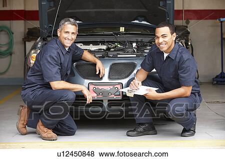 Mechanics at work View Large Photo Image Stock Photo - Mechanics at work. Fotosearch
