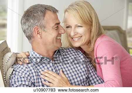 Mid age couple at home View Large Photo Image Stock Image - Mid age couple at home. Fotosearch
