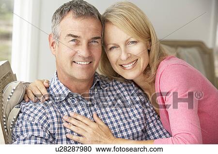Mid age couple at home View Large Photo Image Stock Image - Mid age couple at home. Fotosearch