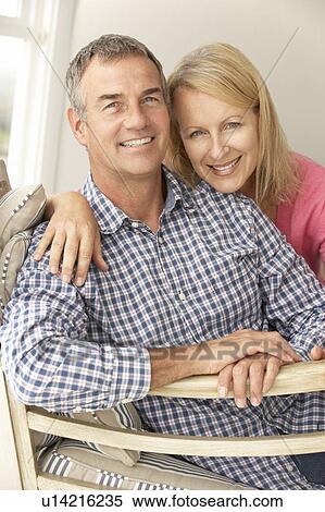 Mid age couple at home View Large Photo Image Stock Photography - Mid age couple at home. Fotosearch
