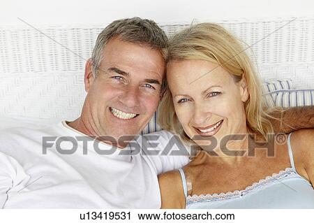 Stock Image - Mid age couple head and shoulders. Fotosearch