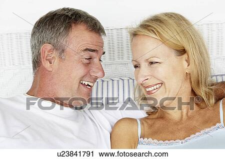 Stock Image - Mid age couple head and shoulders. Fotosearch