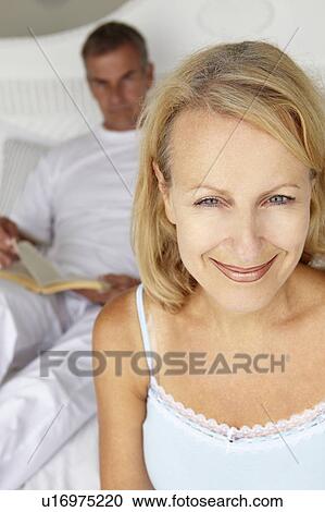 Mid age couple in bedroom View Large Photo Image Stock Image - Mid age couple in bedroom. Fotosearch
