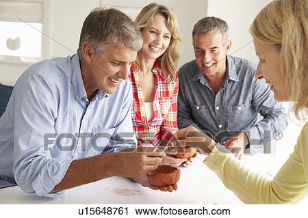 Mid age couples clay modelling View Large Photo Image Stock Image - Mid age couples clay modelling. Fotosearch