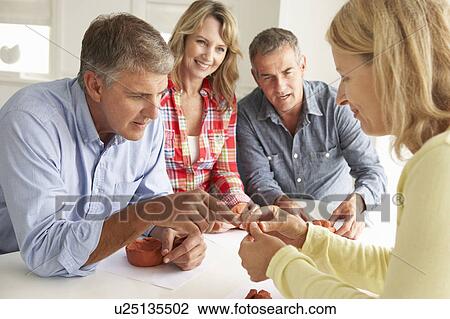Mid age couples clay modelling View Large Photo Image Stock Image - Mid age couples clay modelling. Fotosearch