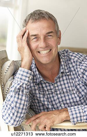 Mid age man at home View Large Photo Image Stock Image - Mid age man at home. Fotosearch